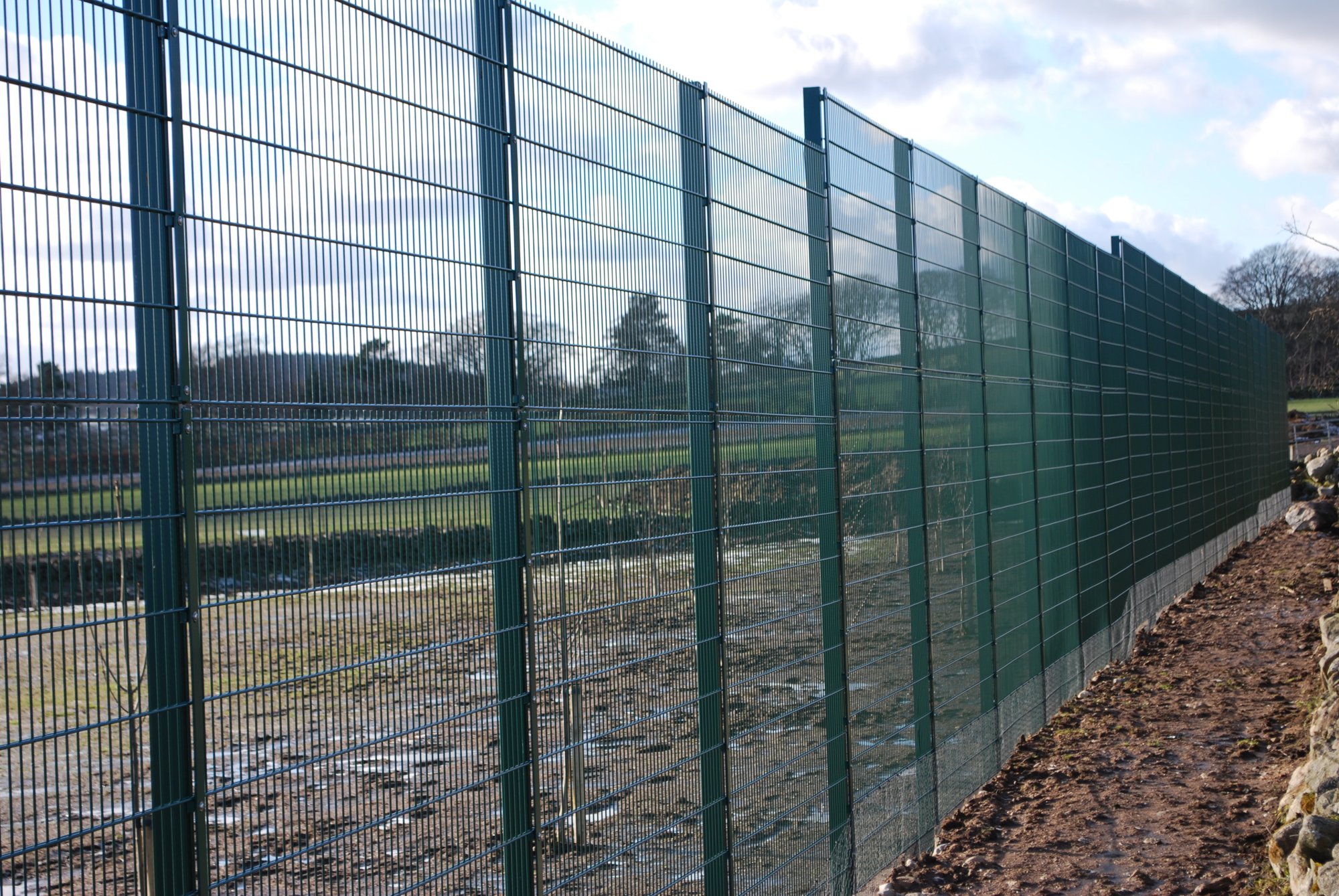 A 3600mm high 868 panel fence, The height was achieved by installing 1200mm high panels above 2400mm high panels.