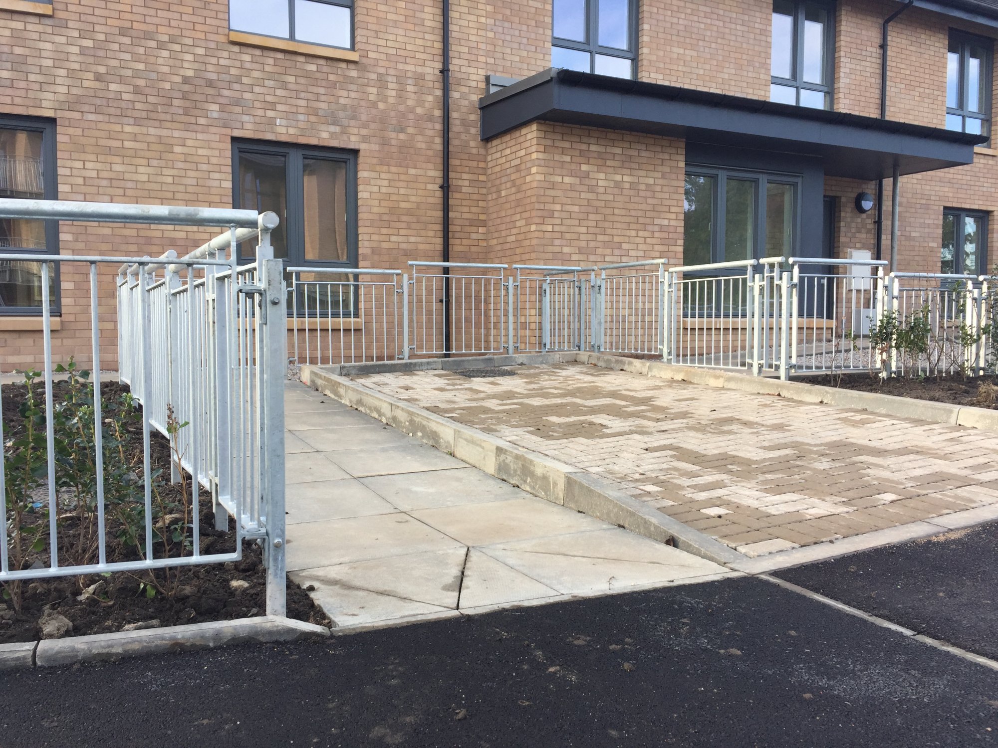Railings to a housing development fabricated and installed in accordance with the architectural details.